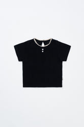 Flat Lay of Avauma Le Petite Classic Black Short Sleeve Top, Soft Cotton Puff Sleeve T-Shirt for Toddlers